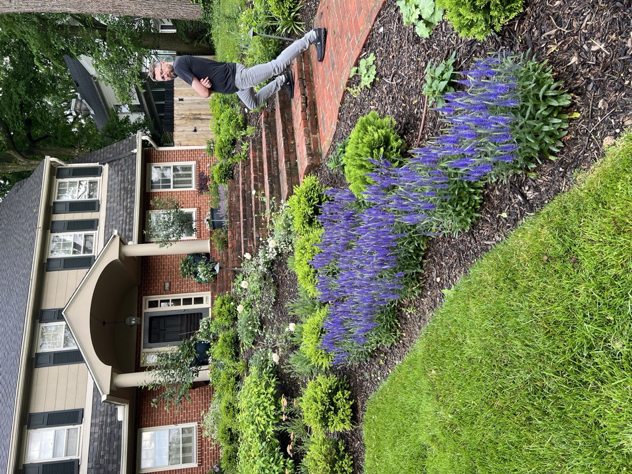 Blue glazed container plantings on the brick front steps