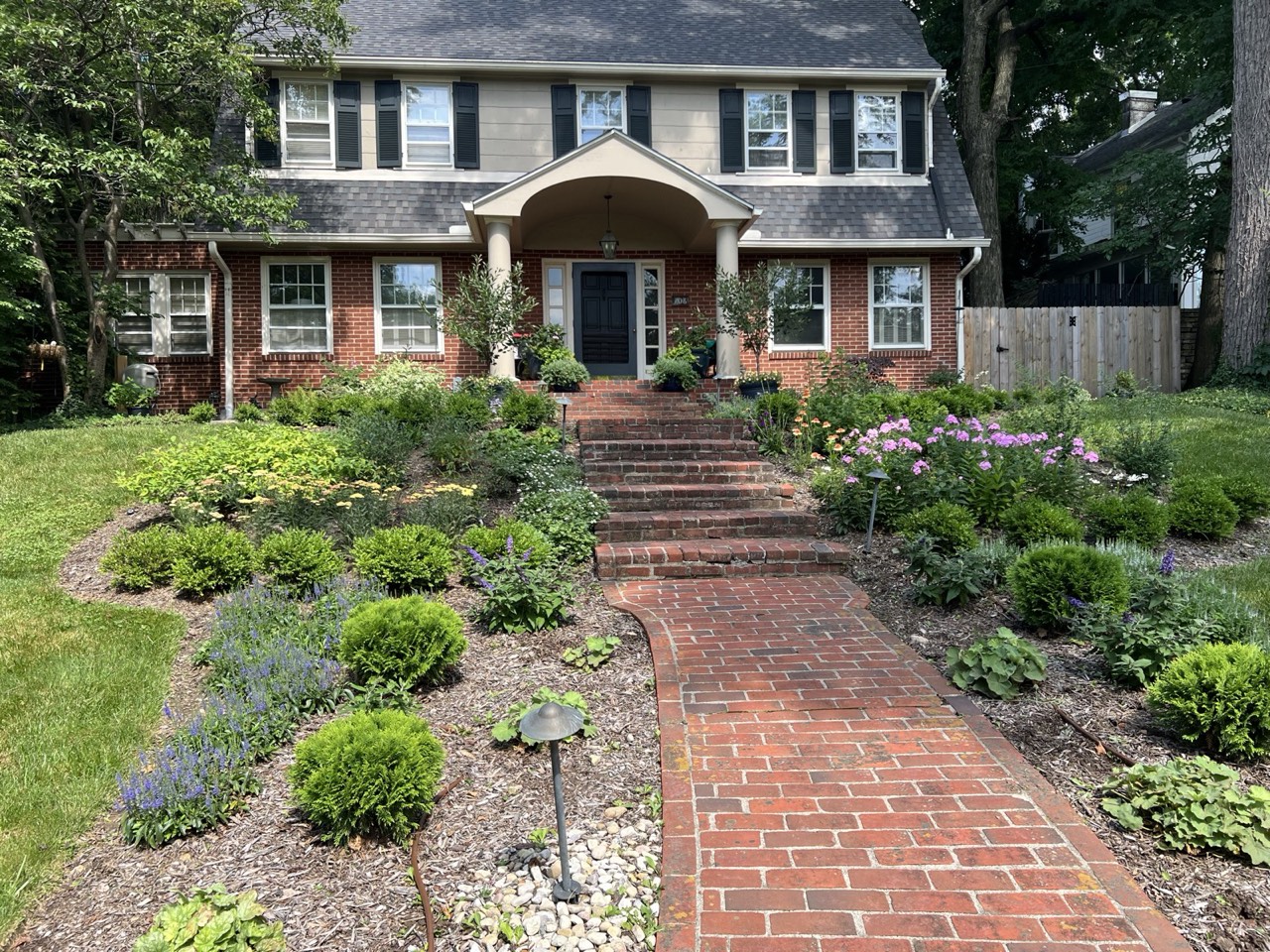 Front garden with lavender and perennial beds along the path