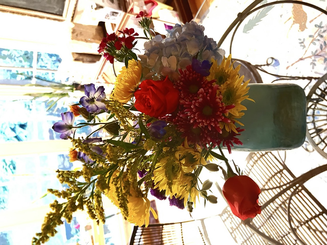 Bright mason-jar bouquet with sunflowers and mixed blooms