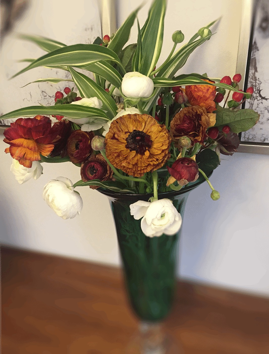 Autumn flower arrangement in green vase
