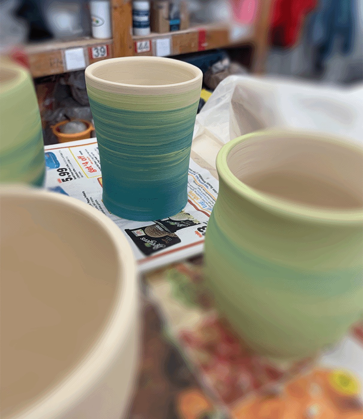 A set of glazed ceramic cups in the studio