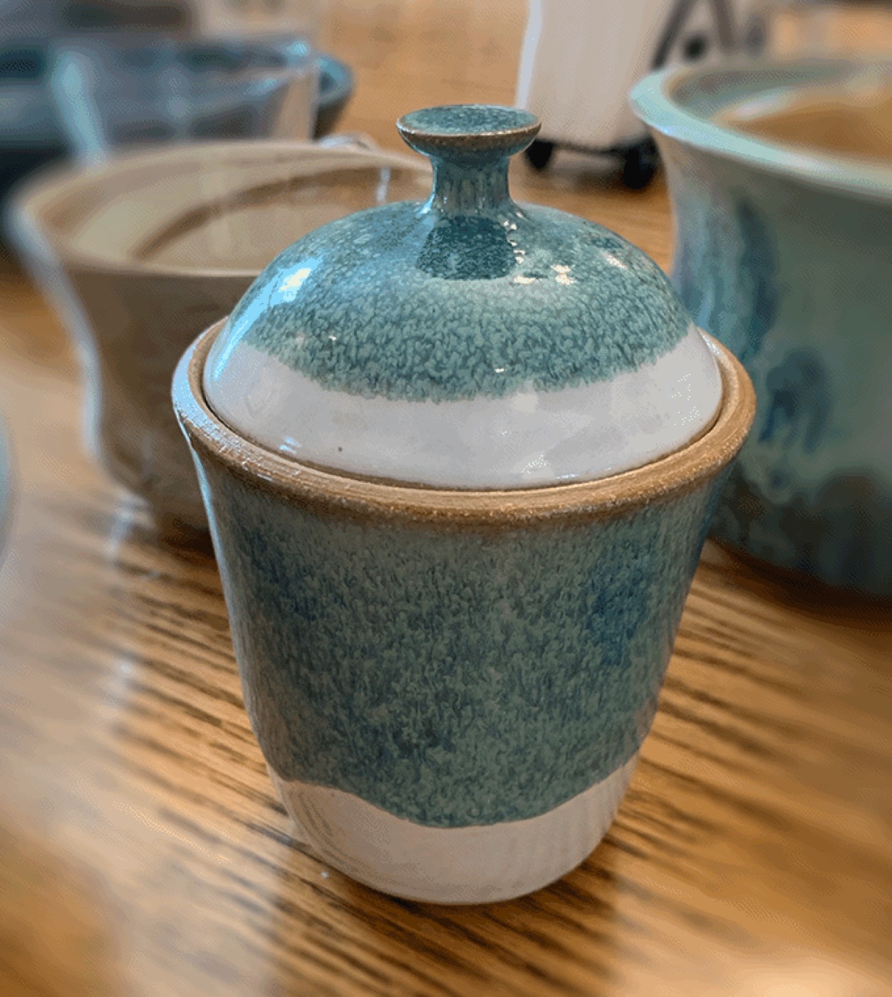 Lidded ceramic jar with teal glaze
