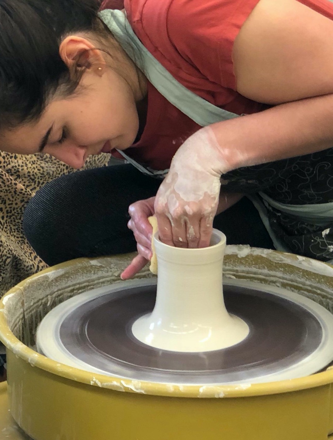 Throwing a vessel on the pottery wheel