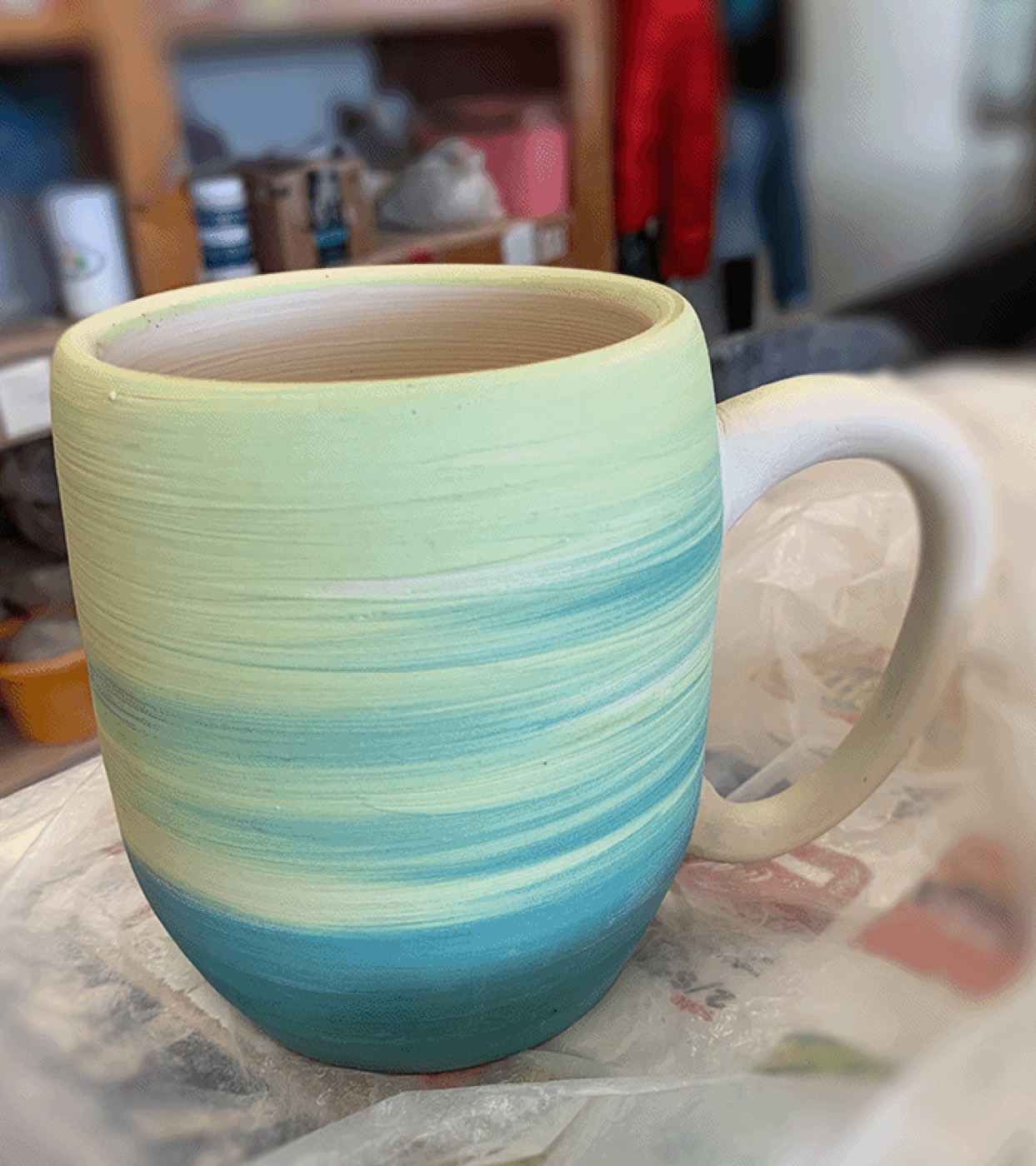 Hand-thrown mug with teal ombré glaze
